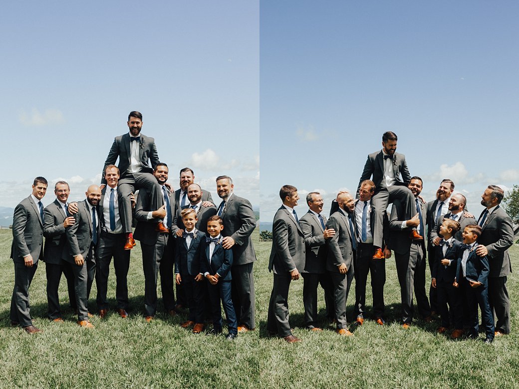 Cliff being lifted into the air by groomsmen 
