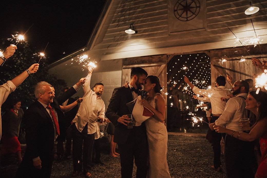 Hadley and Cliff leaving wedding reception during sparkler exit 