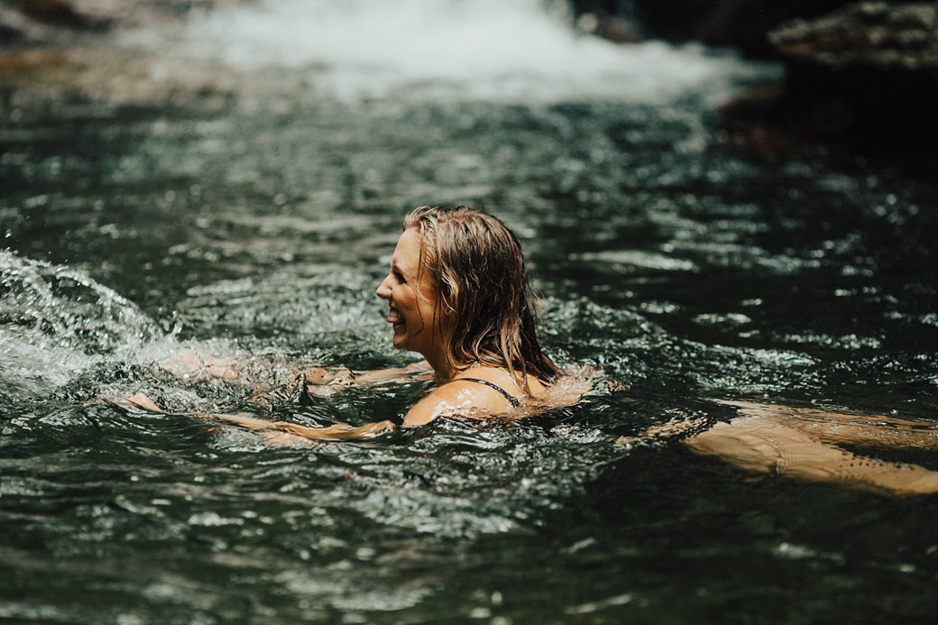 Tess splashing in the water at Skinny Dip Falls 