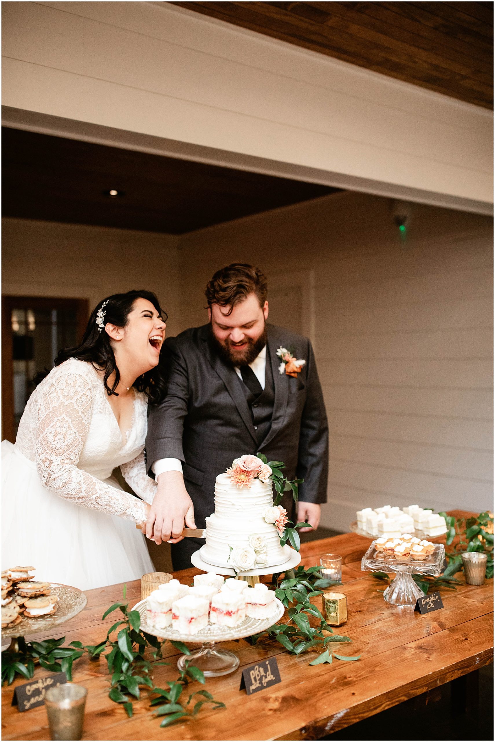 bride and groom cutting wedding cake at nc wedding reception