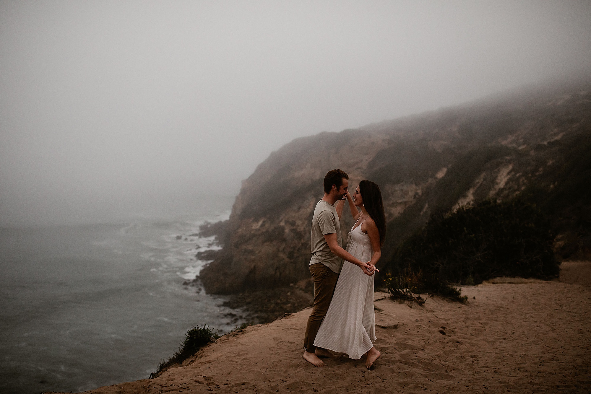couple dancing above beach point dume malibu engagement photo locations