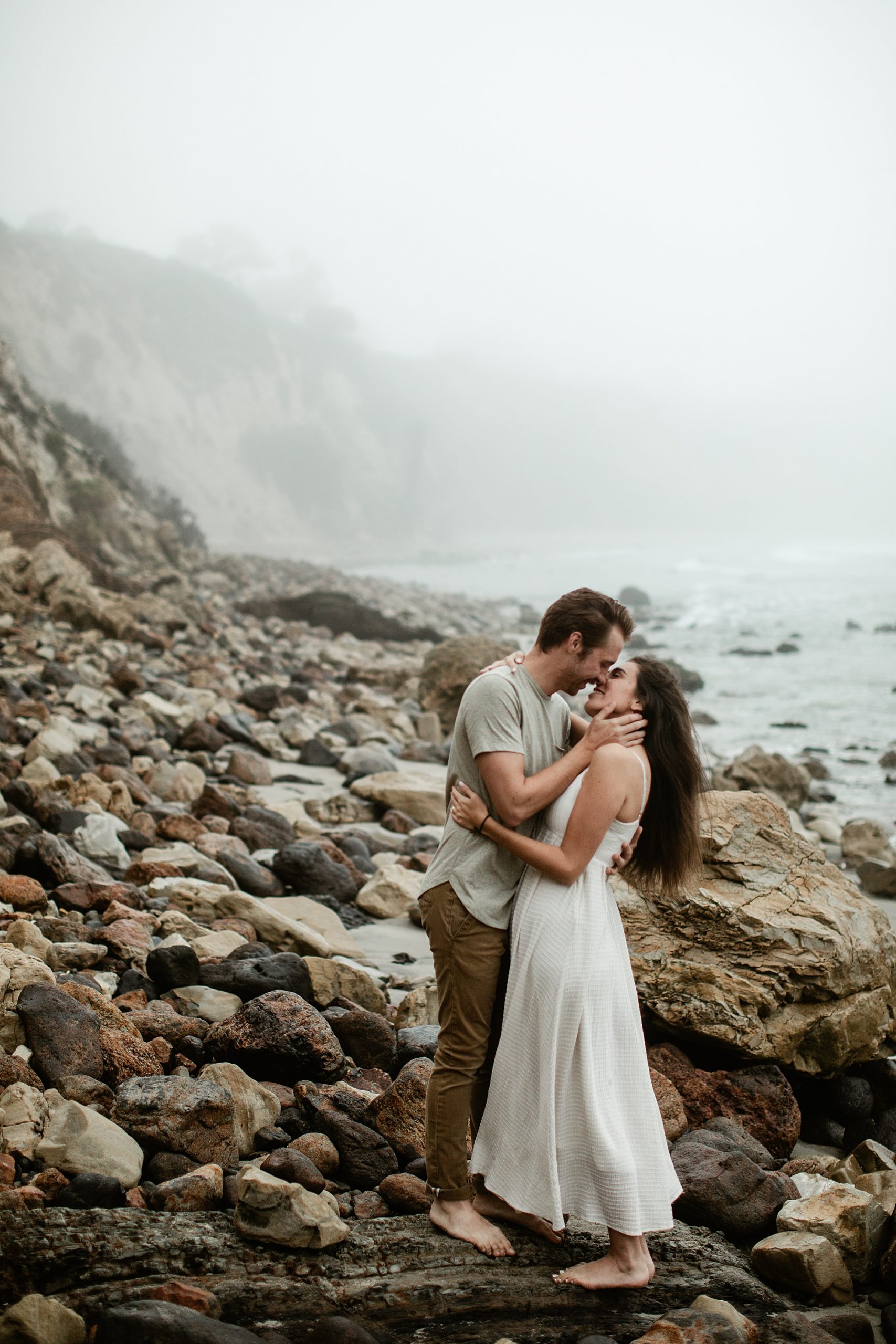 guy kissing girl point dume one year anniversary session
