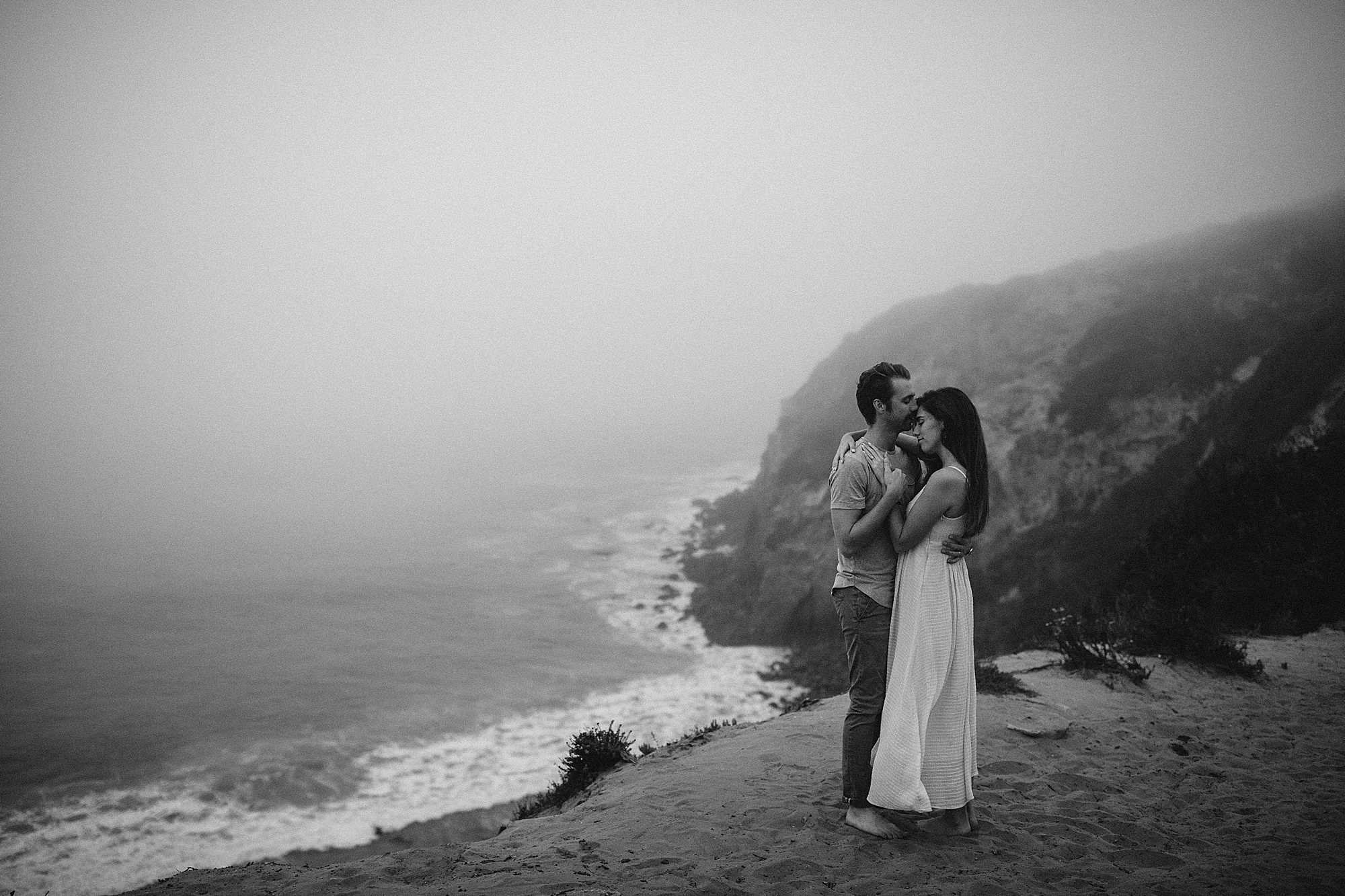 guy holding girl malibu beach engagement photos california